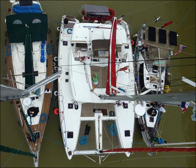 13. Dunbar's super photo he took of Joyful, Aventura, and a catamaran rafted together to transit the Panama Canal locks on both days. He went to the tope of Aventura's mast to take this photo. Thank you, Dunbar!