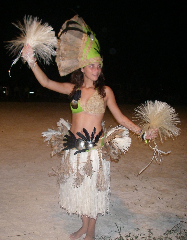 27. The beautiful Polynesian dancer, Tamatea, from the Faanui dance troup.  Banana leaves, feathers, and shells making up her clothes had to be from French Polynesia, and locally made as well. Her mother and grandmother made the traditional clothes.