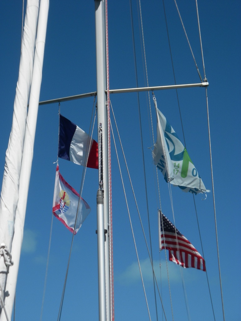 5. Joyful's flags in Bora Bora.  The USA ensign flew from Joyful's backstay, the Blue Planet Odyssey flag few from her port spreader halyard, and the French and French Polynesia flags flew from her starboard spreader halyard.