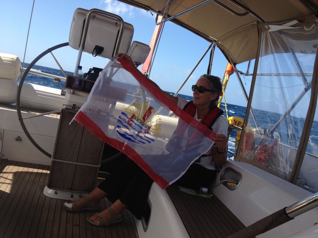 58. Anne finished sewing the edges of the French Polynesian courtesy flag she constructed for Joyful.