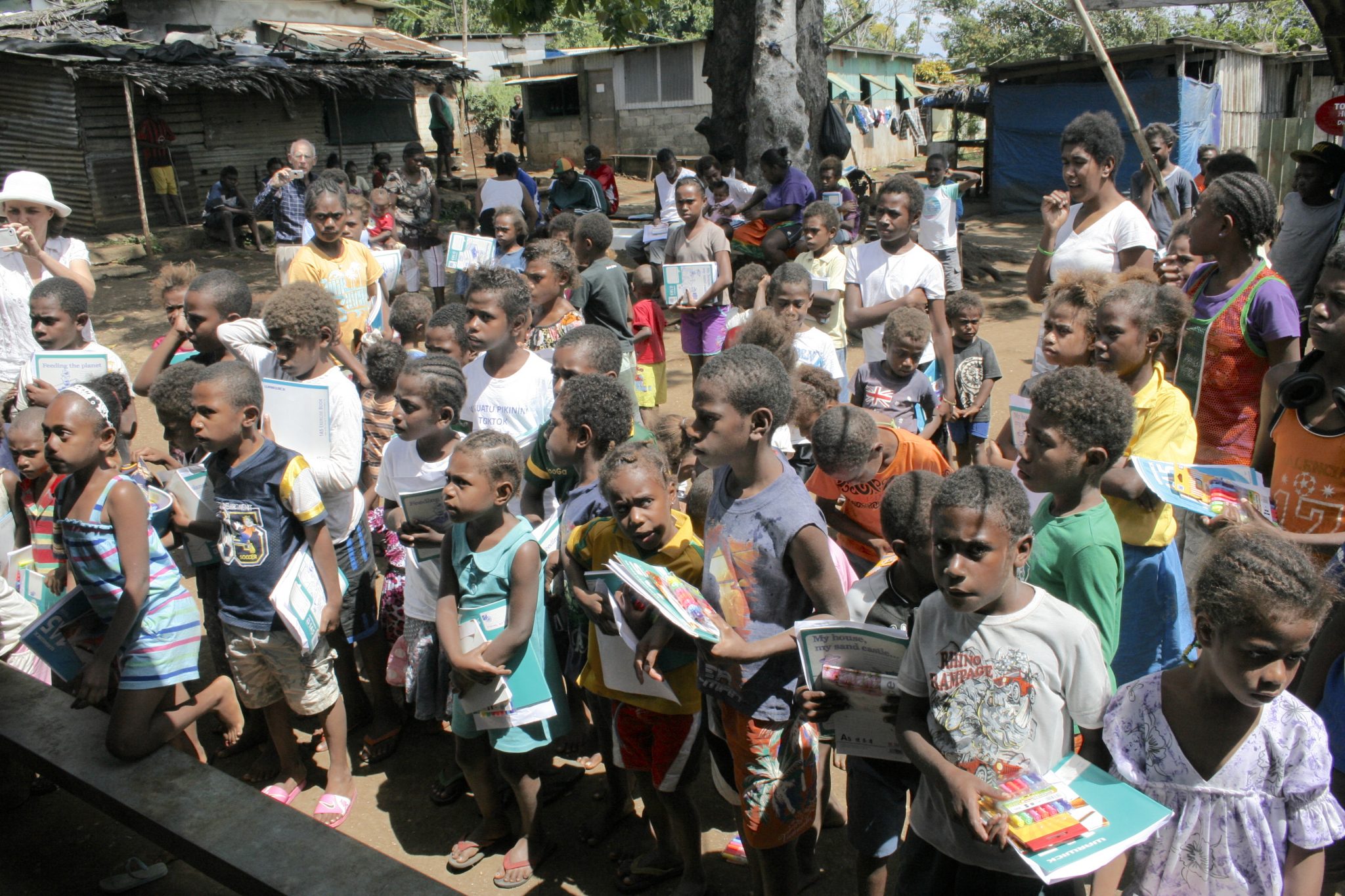 63-some-of-the-141-children-await-their-school-supply-kits-all-180-children-in-the-village-received-kits