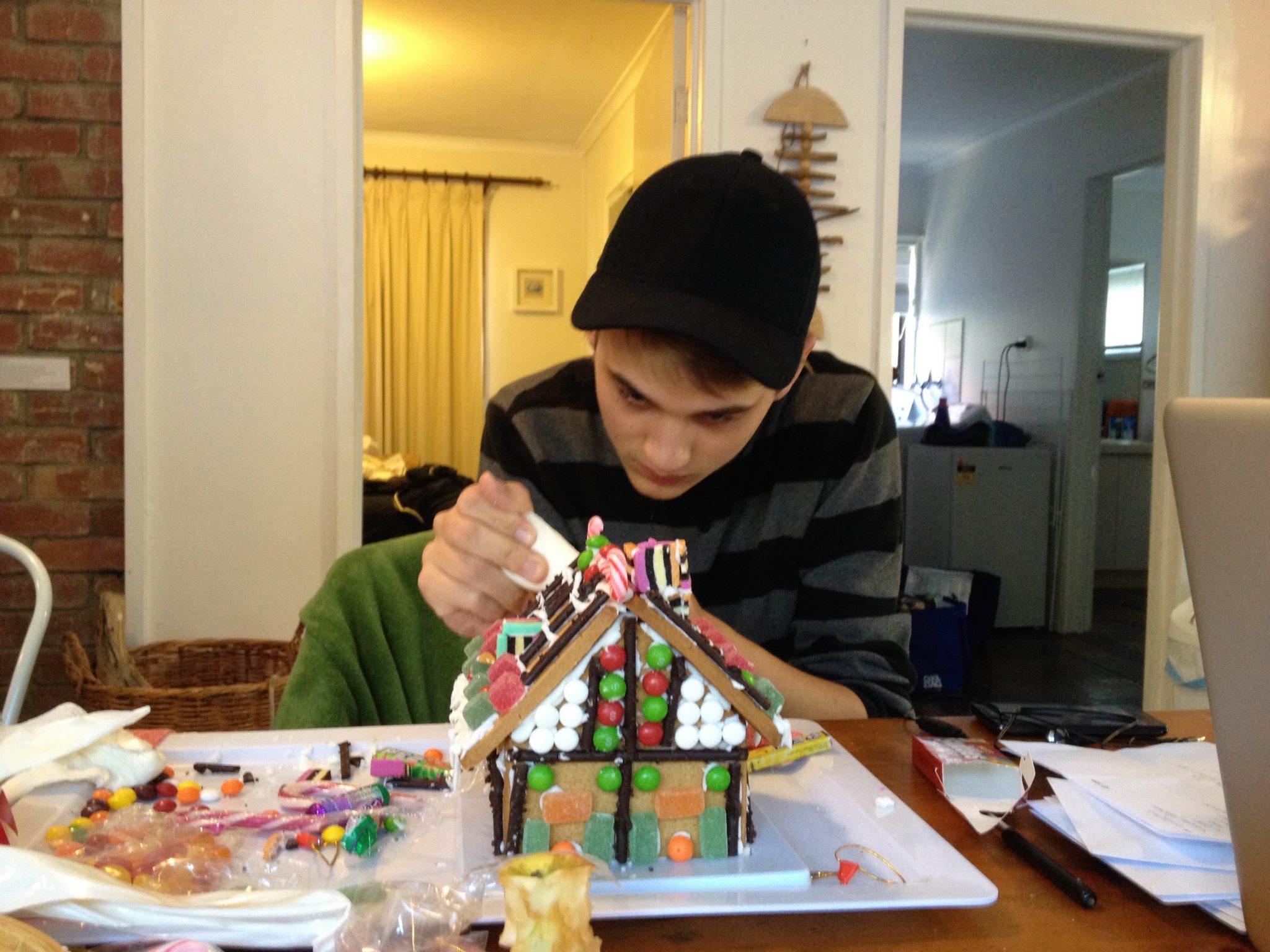125. Seventeen year old Josh making the gingerbread house he graceously gave to residents of an elder care facility on Phillip Island, Australia copy